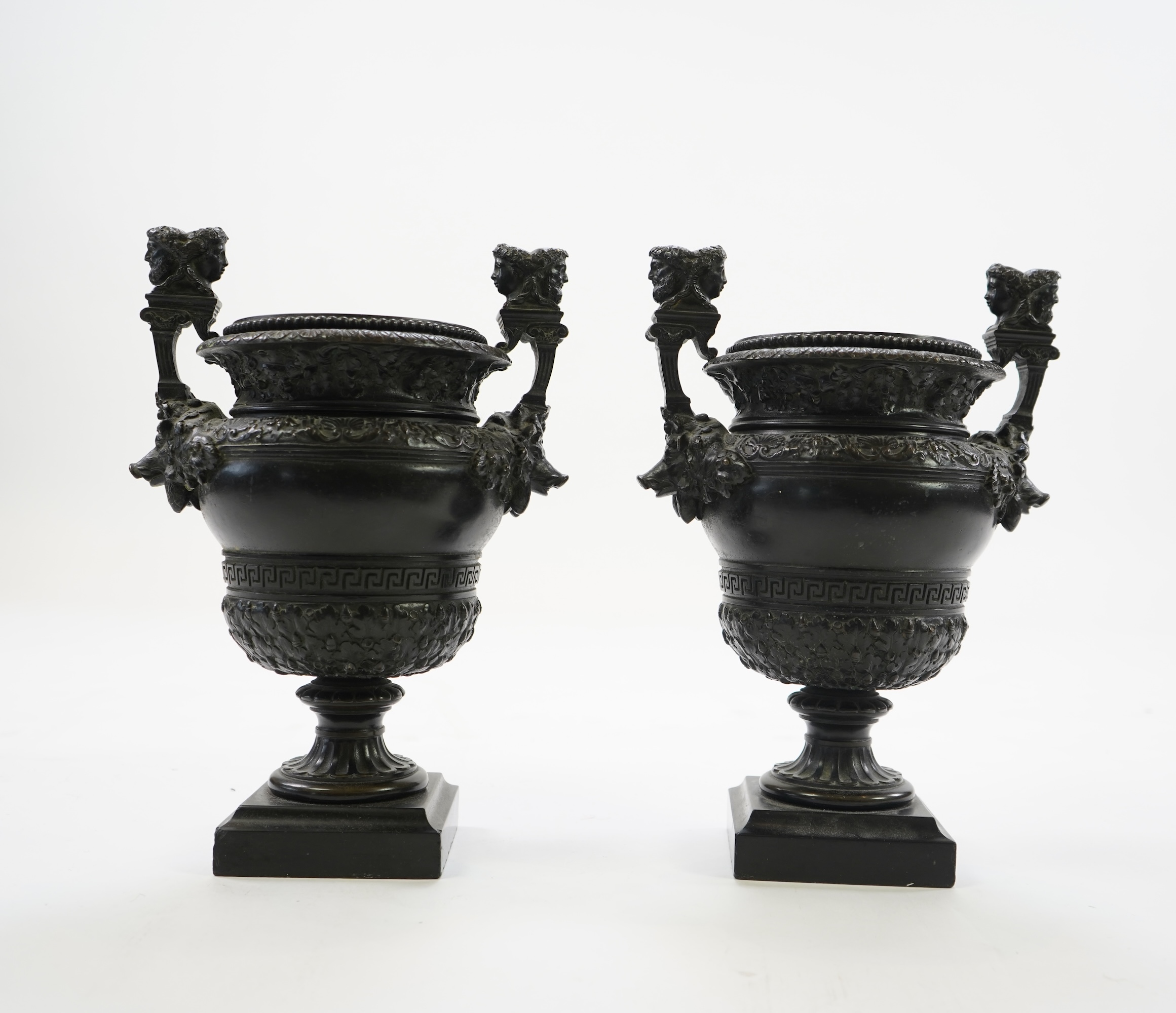 A pair of neoclassical revival bronze urns, late 19th century